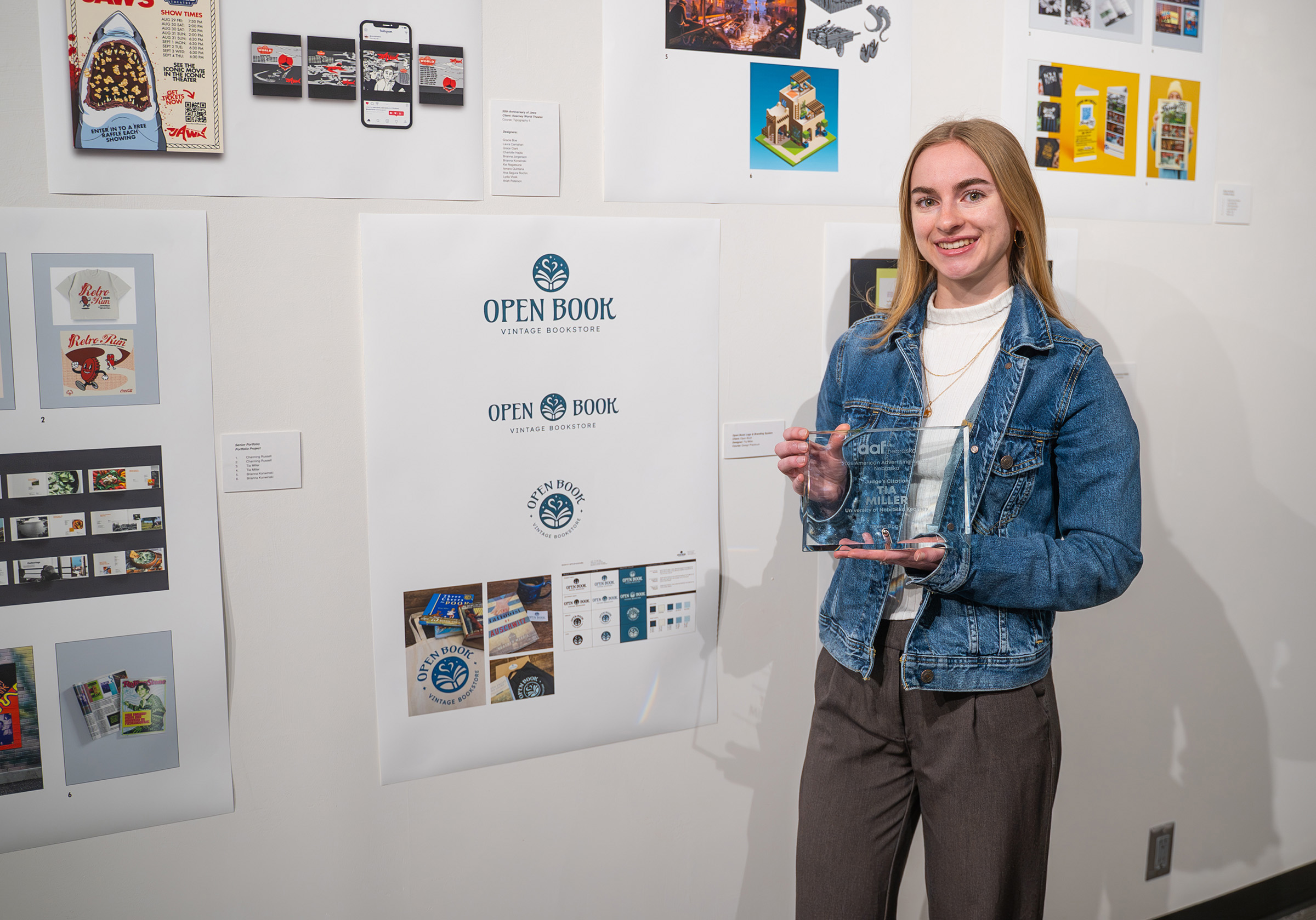 UNK senior Tia Miller poses for a photo with her design project and award.