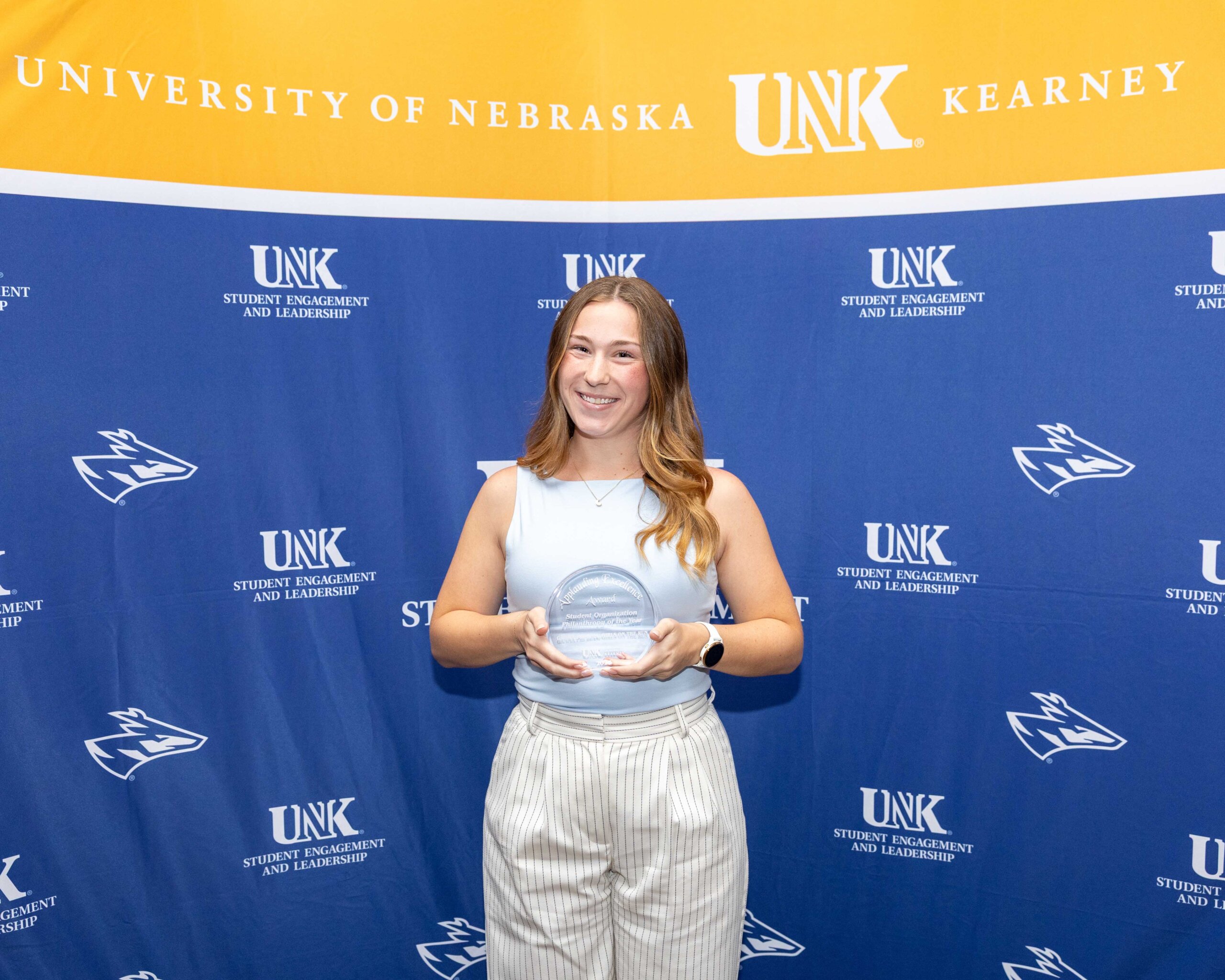 Gamma Phi Beta accepts the student organization philanthropy of the year award.