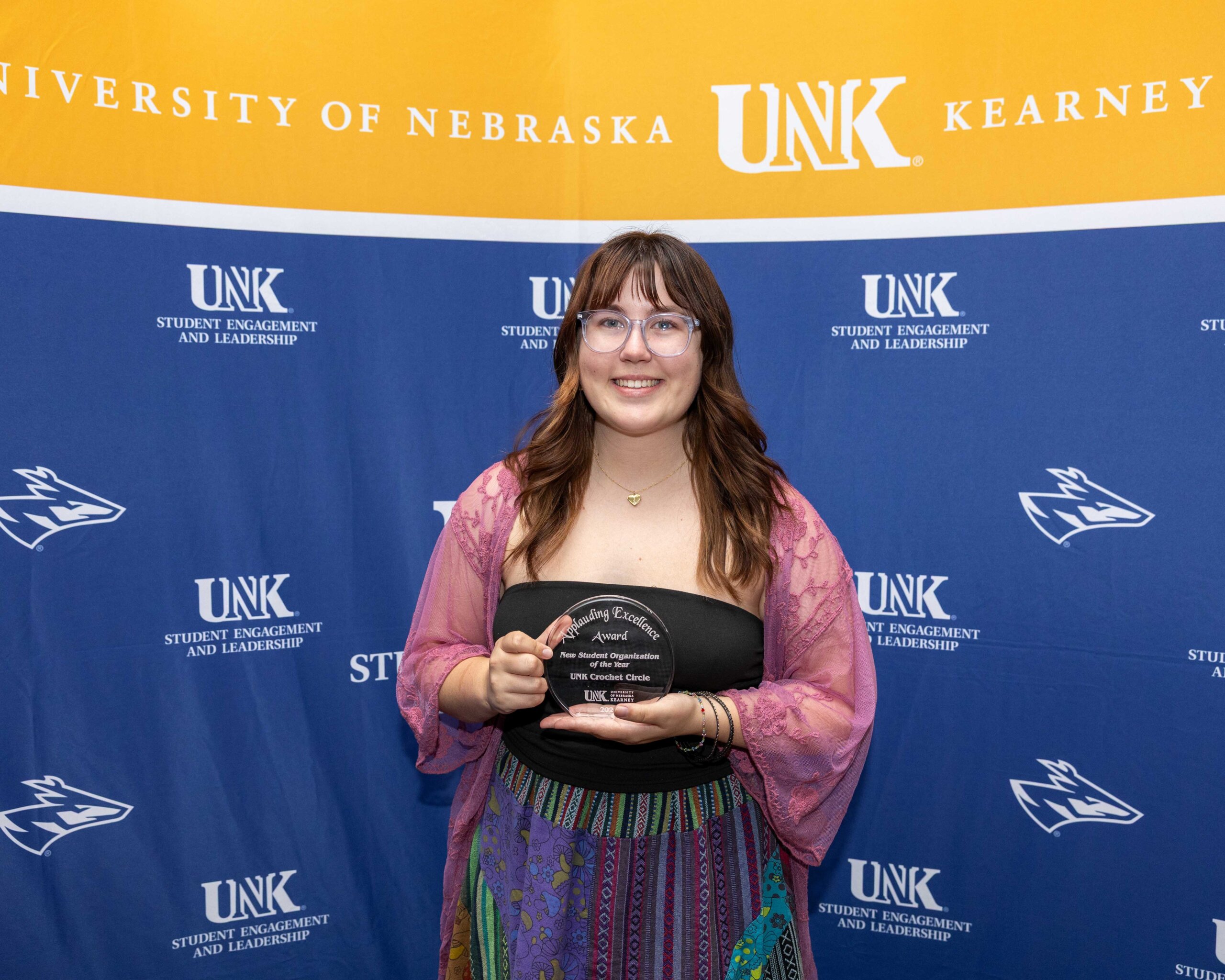 UNK Crochet Circle accepts the new student organization of the year award.