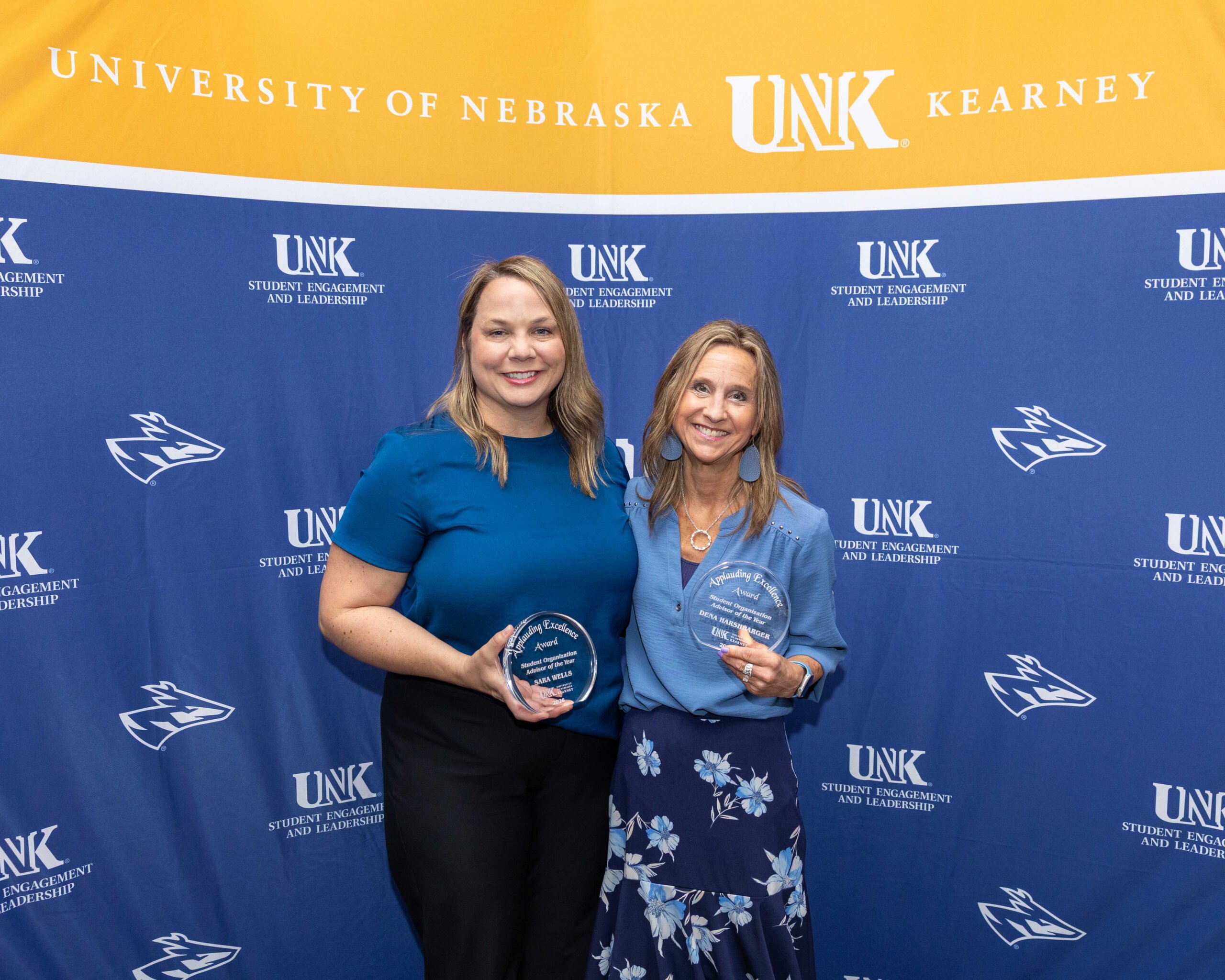 Sara Wells and Dena Harshbarger are recognized as student organization advisers of the year.