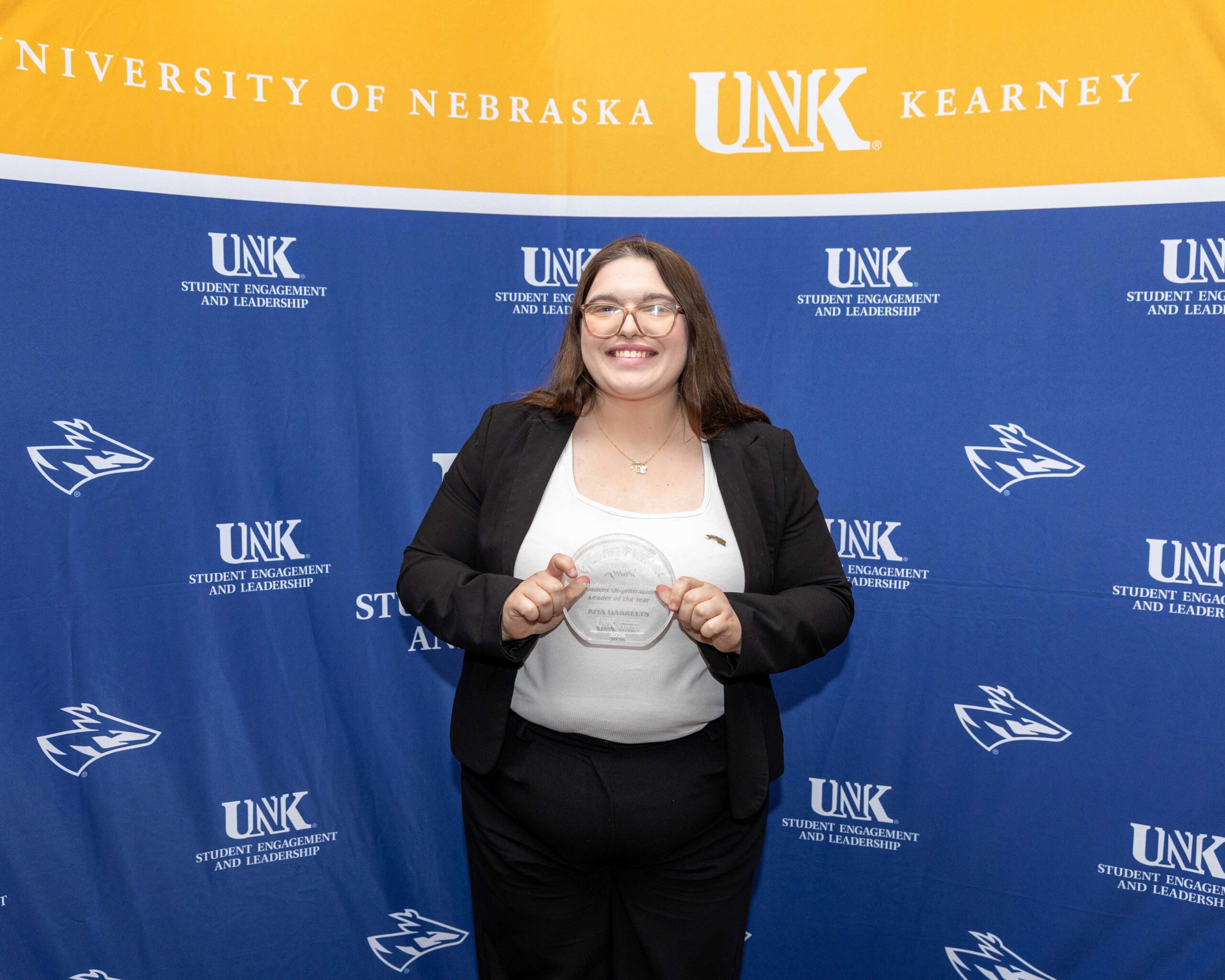 Kiya Garrelts accepts the student organization leader of the year award.
