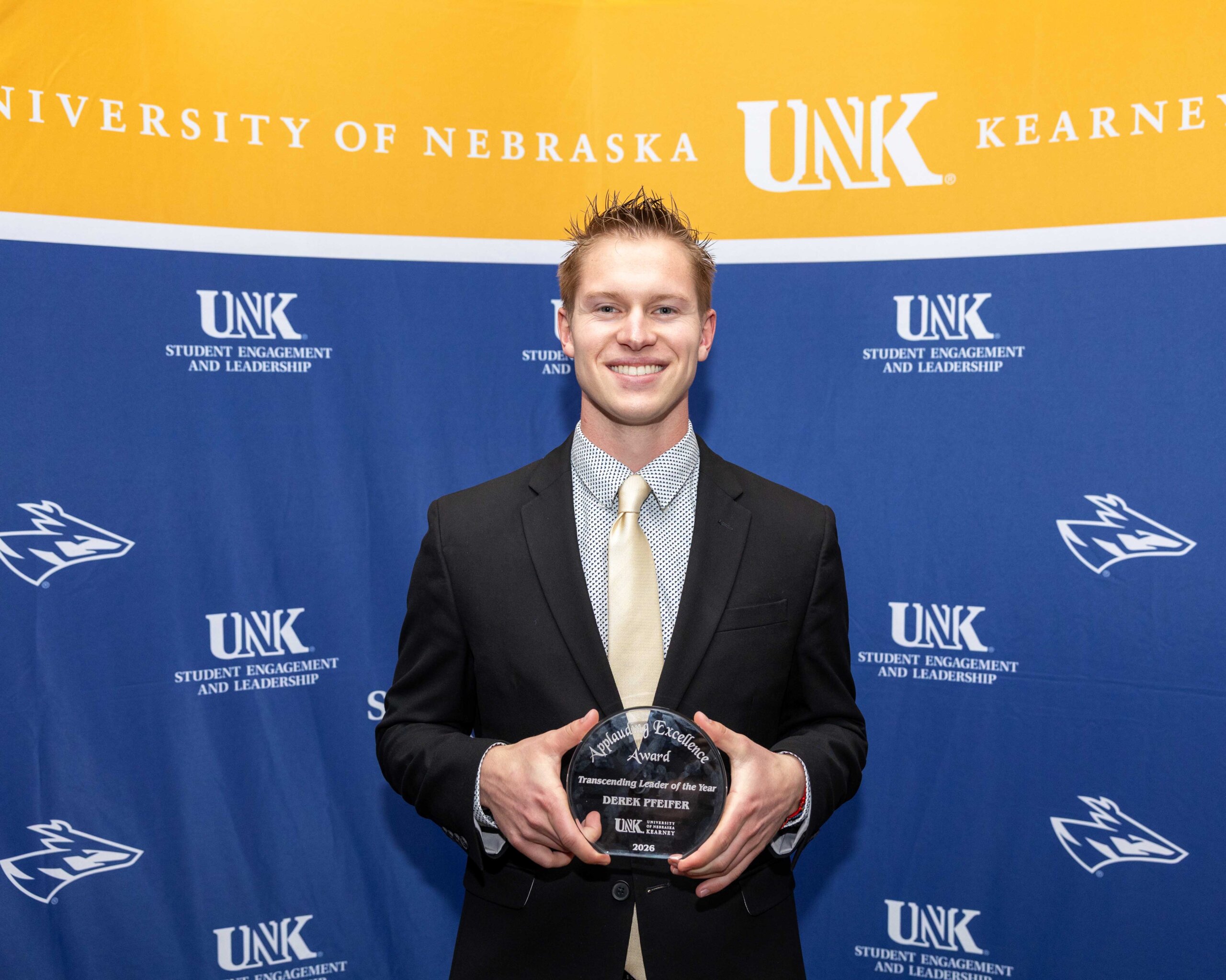 Derek Pfeifer accepts the transcending leader award.