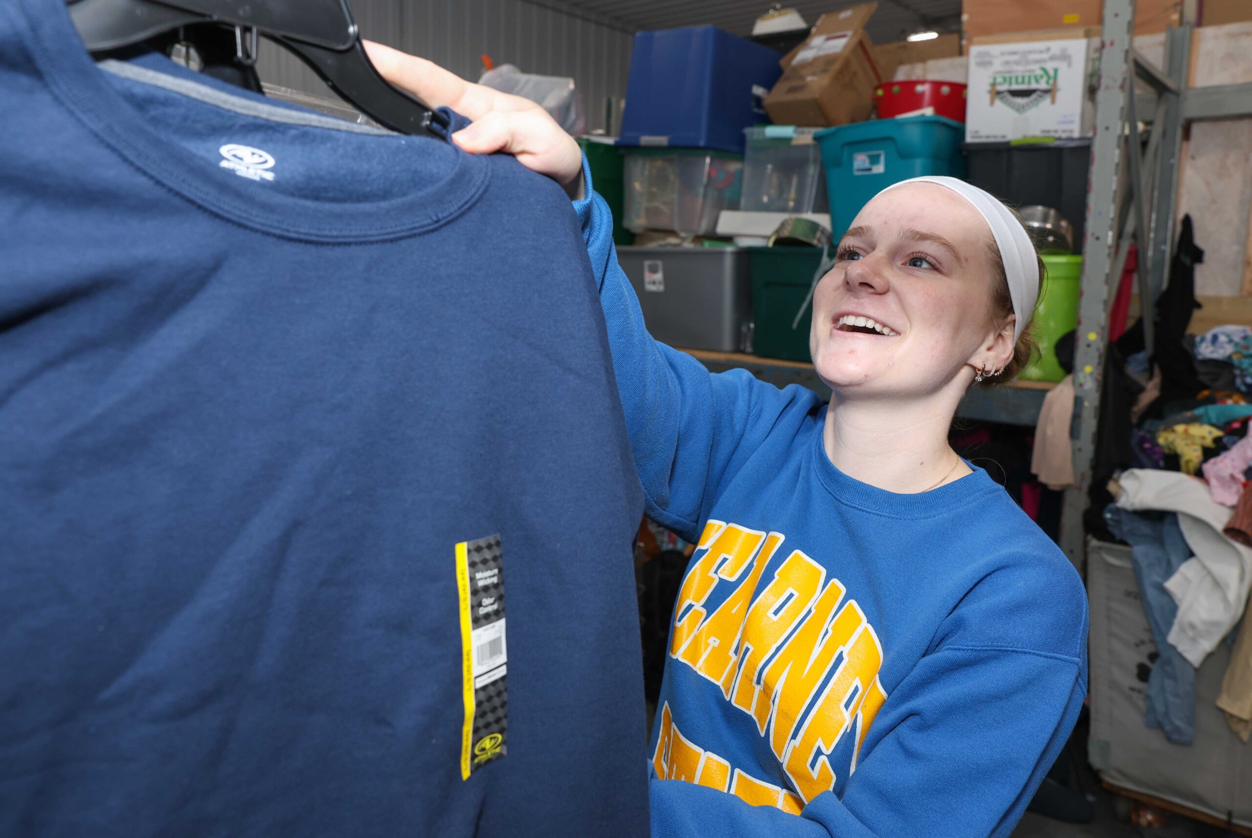 UNK sophomore Isabel Zaruba of Columbus volunteers at Crossroads Mission Avenue in Kearney during The Big Event.