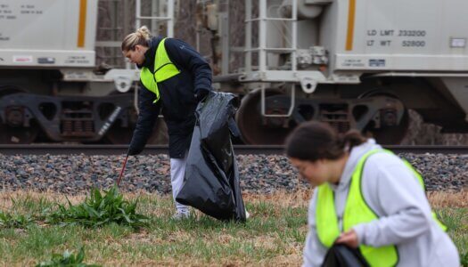 UNK students pick up trash along Railroad Street.