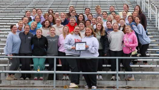 Members of the Alpha Omicron Pi sorority pose for a photo.