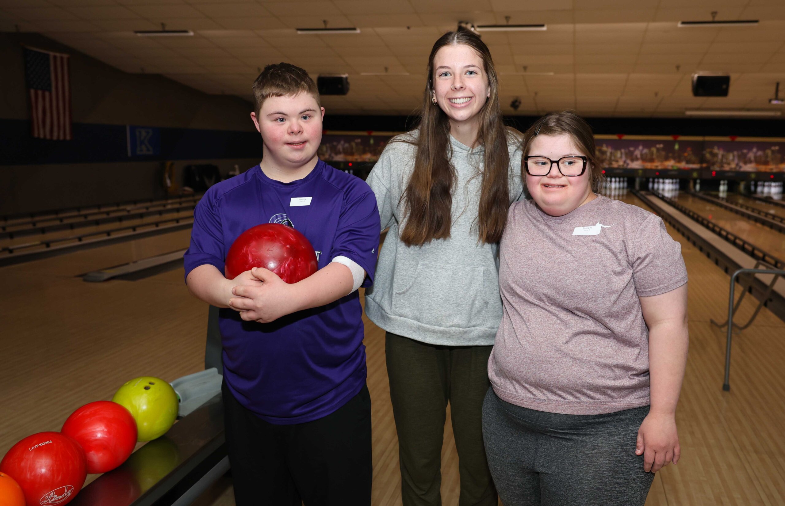 UNK senior Audrey Belew poses for a photo with Buddy Bowling participants.