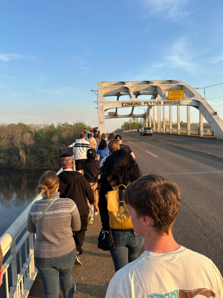 Students cross Edmund Pettus Bridge in Selma.