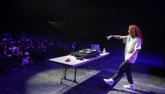 DJ Redlocks performs during the UNK spring concert.