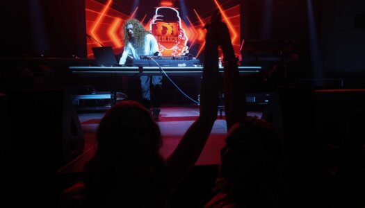 DJ Redlocks performs during the UNK spring concert.