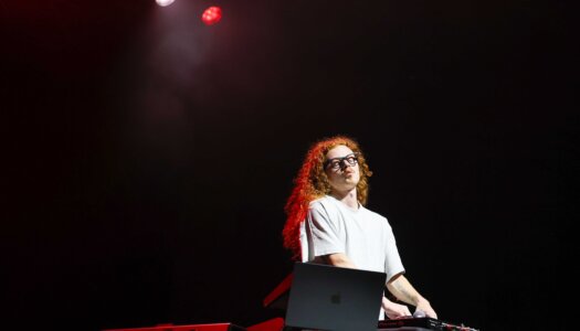 DJ Redlocks performs during the UNK spring concert.