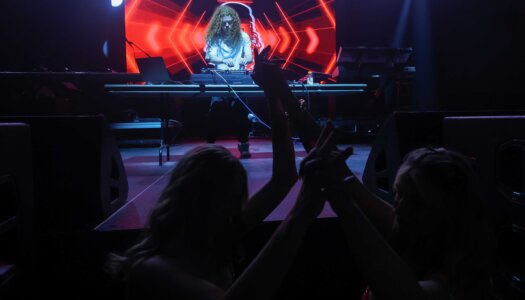 DJ Redlocks performs during the UNK spring concert.