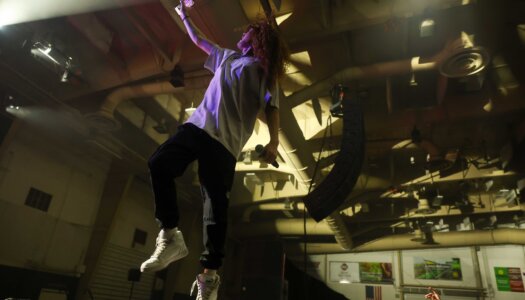DJ Redlocks performs during the UNK spring concert.
