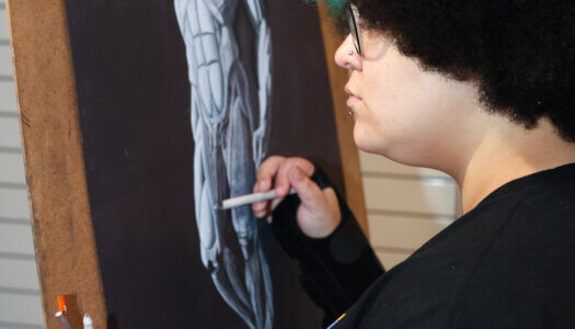 An art student draws a sculpture (Photo by Erika Pritchard, UNK Communications).