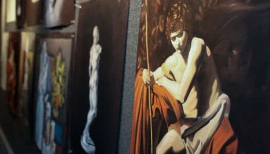 Student art is hung on the art wing wall (Photo by Erika Pritchard, UNK Communications).