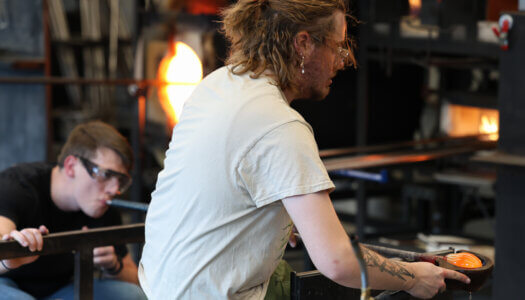 Students create glass pieces in the glassblowing studio (Photo by Erika Pritchard, UNK Communications).