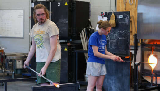 Students create glass pieces in the glassblowing studio (Photo by Erika Pritchard, UNK Communications).