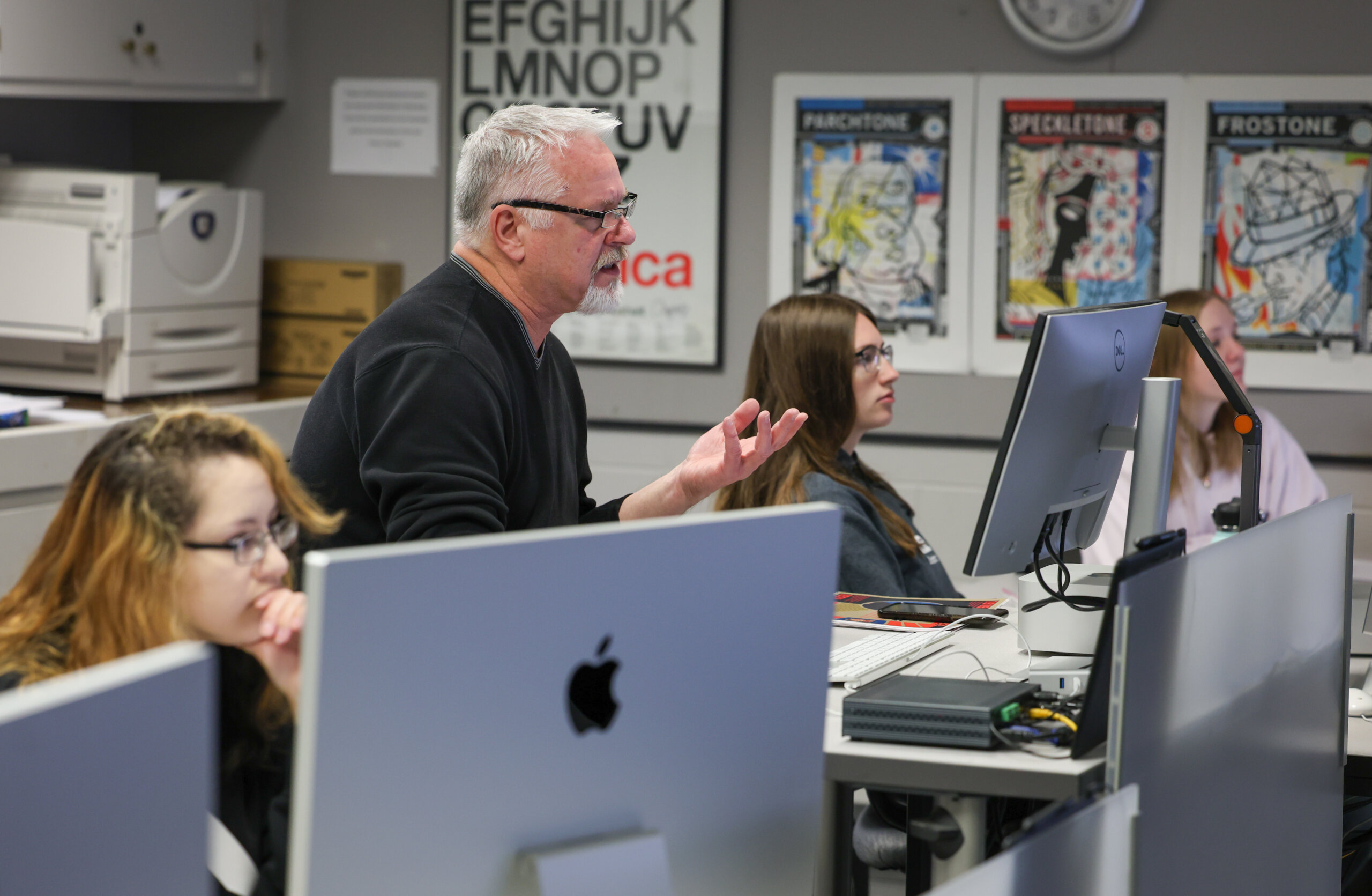 An instructor teaches graphic design.