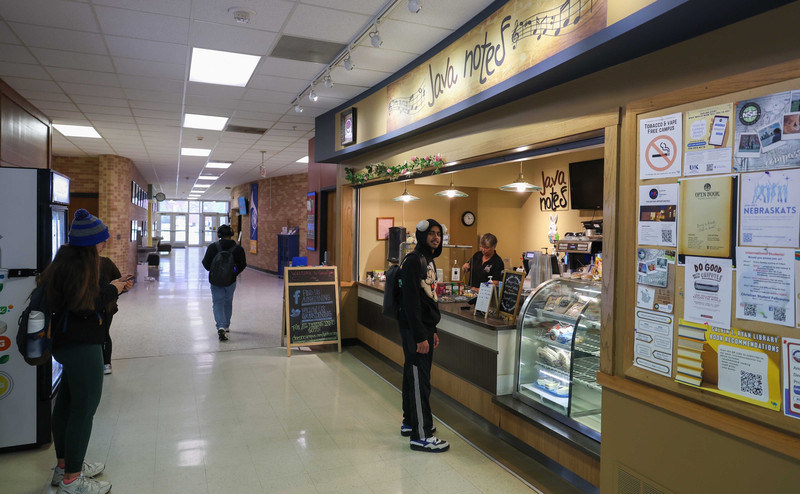 Students wait at a coffee shop.