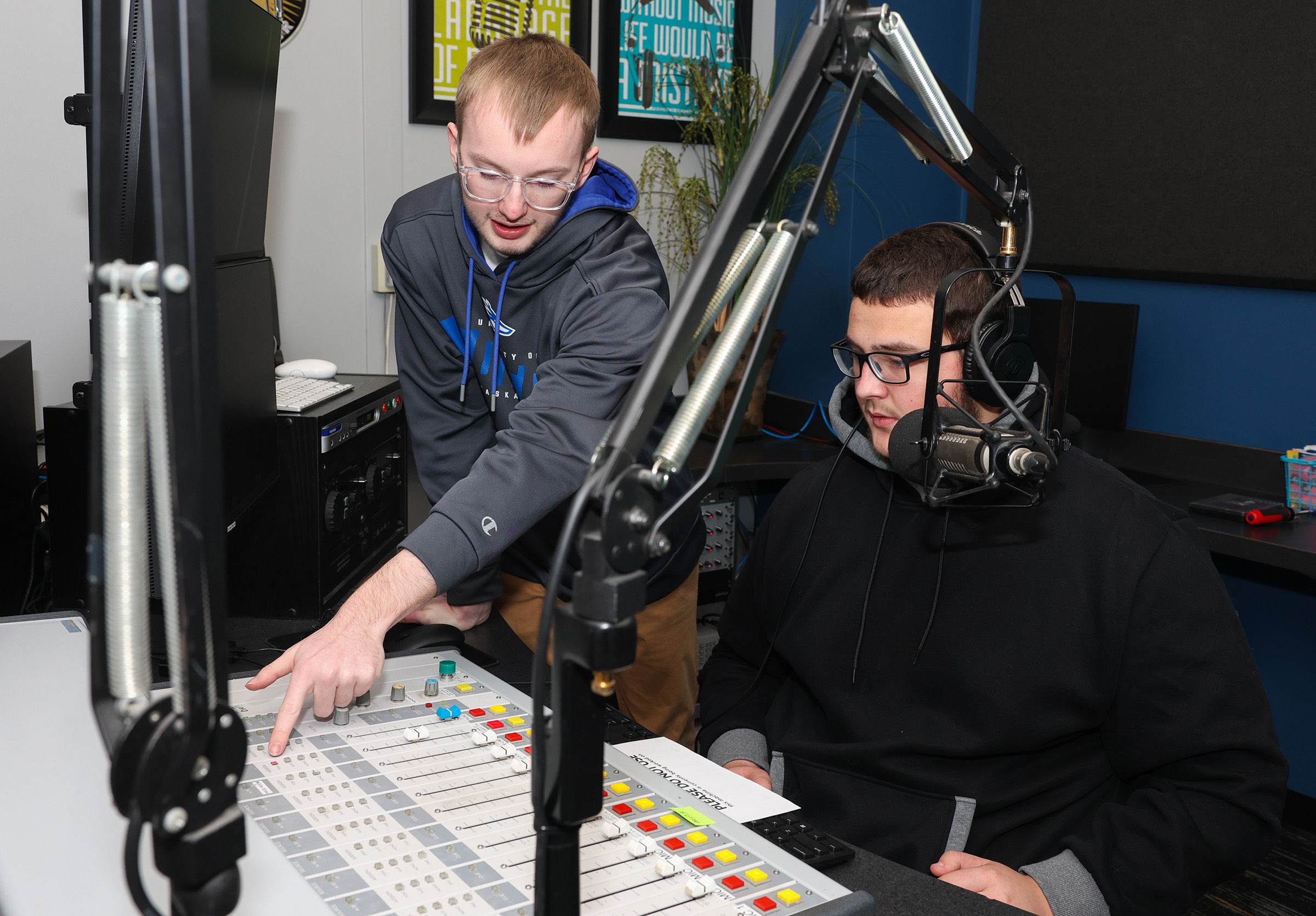 UNK senior Elijah Moser discusses the recent upgrades to the campus radio station during a broadcasting class.