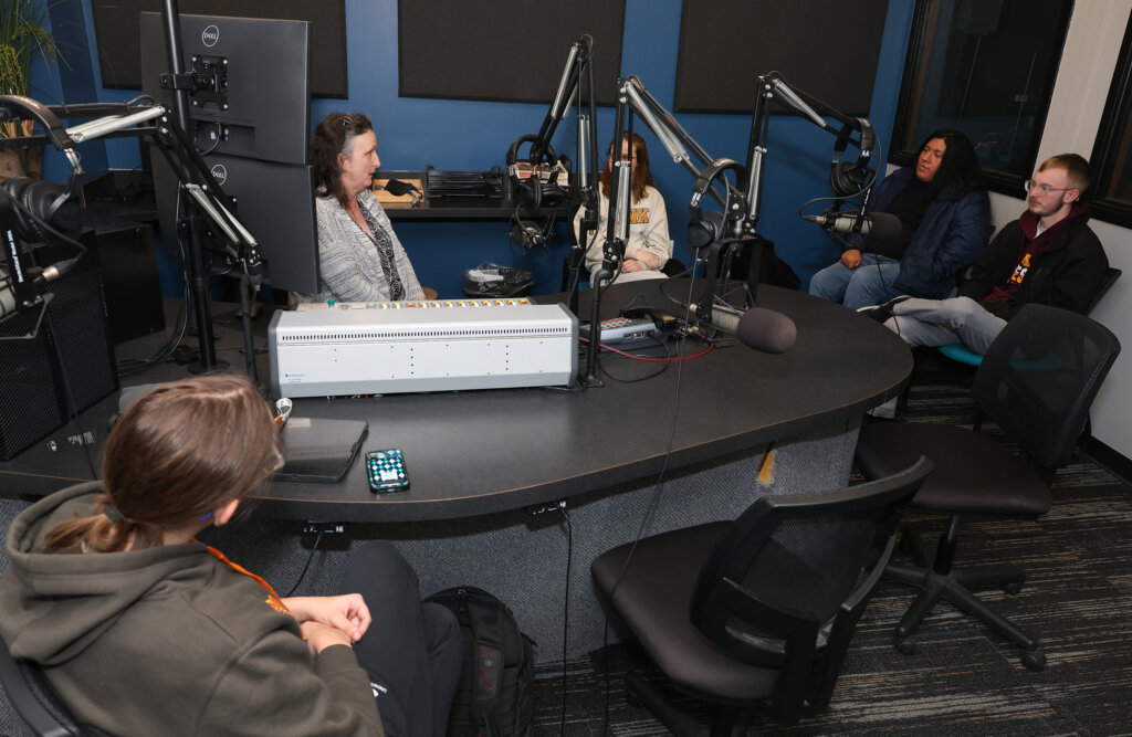 A KLPR staff meeting in the campus studio.