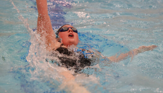 Maggie Wells competes for UNK swimming.