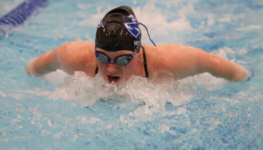 Maggie Wells competes for UNK swimming.