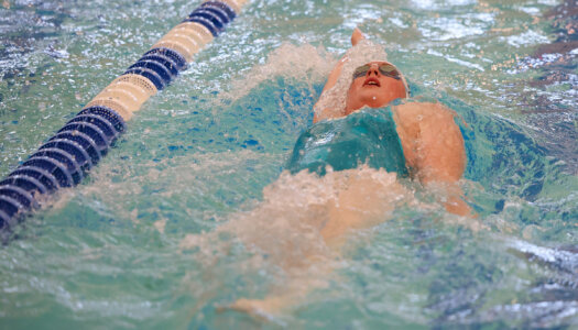 Maggie Wells competes for UNK swimming.