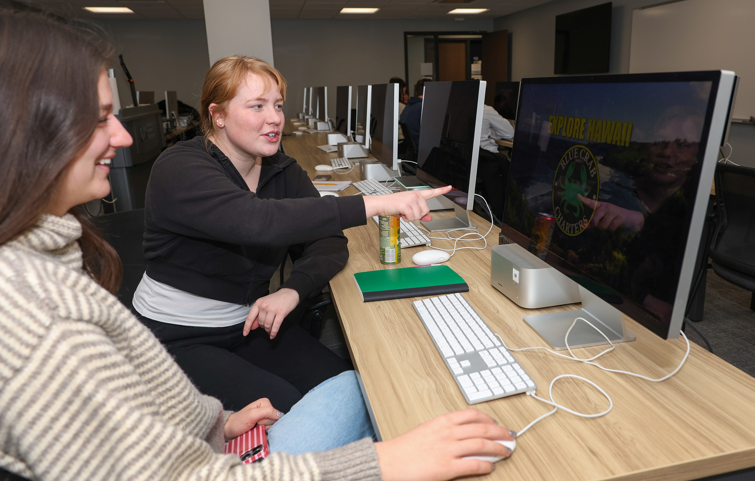 Maggie Wells works on a project in a communication classroom.
