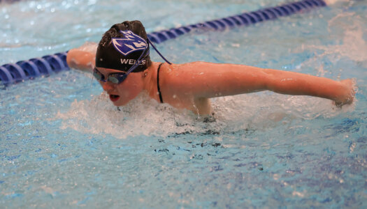 Maggie Wells competes for UNK swimming.