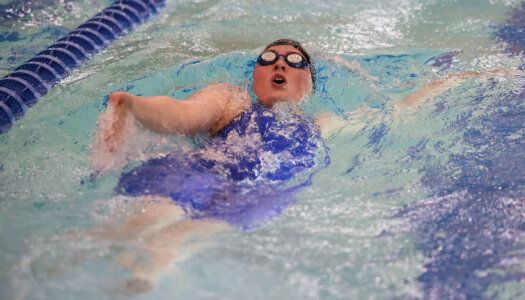 Maggie Wells competes for UNK swimming.