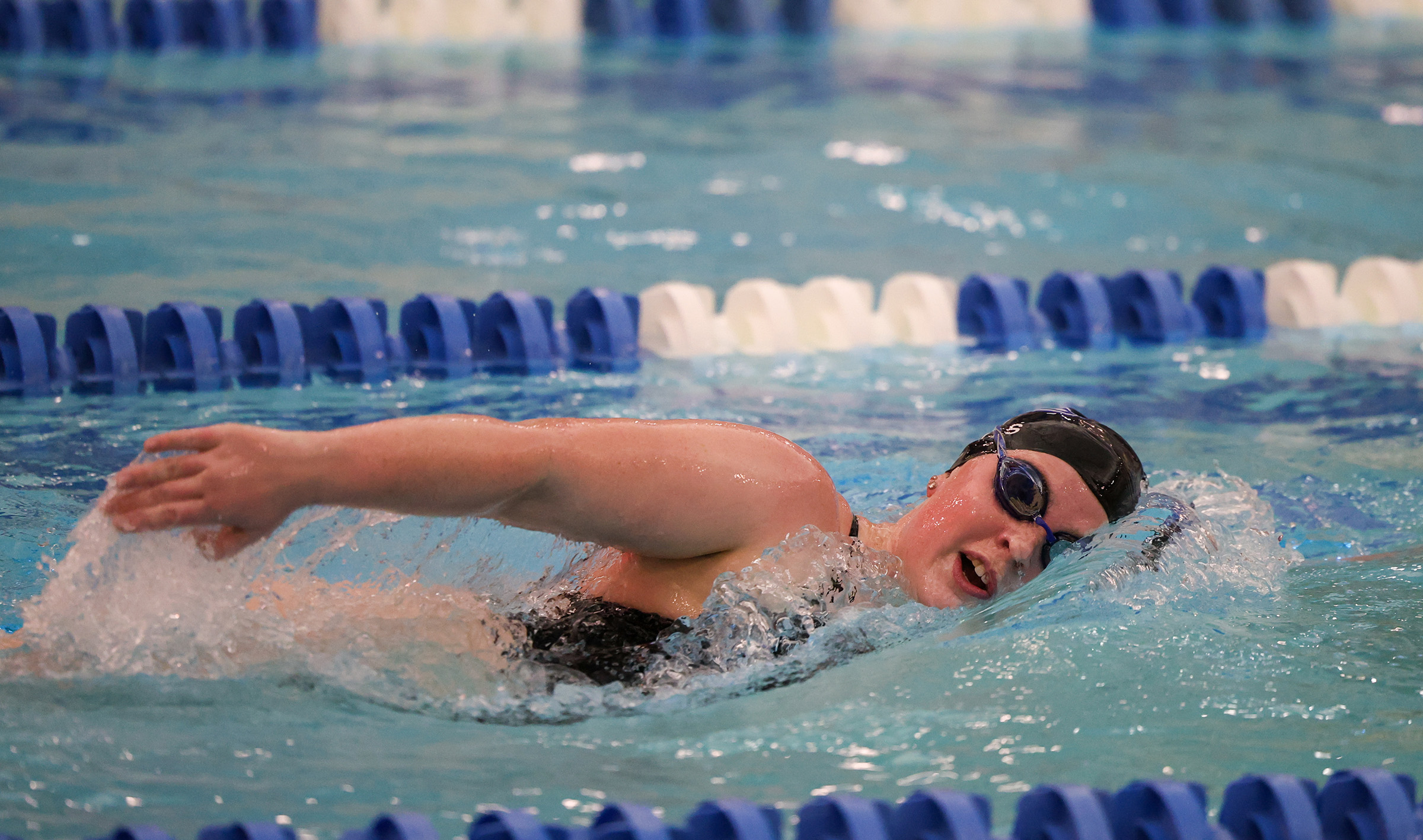 Maggie Wells competes for UNK swimming.