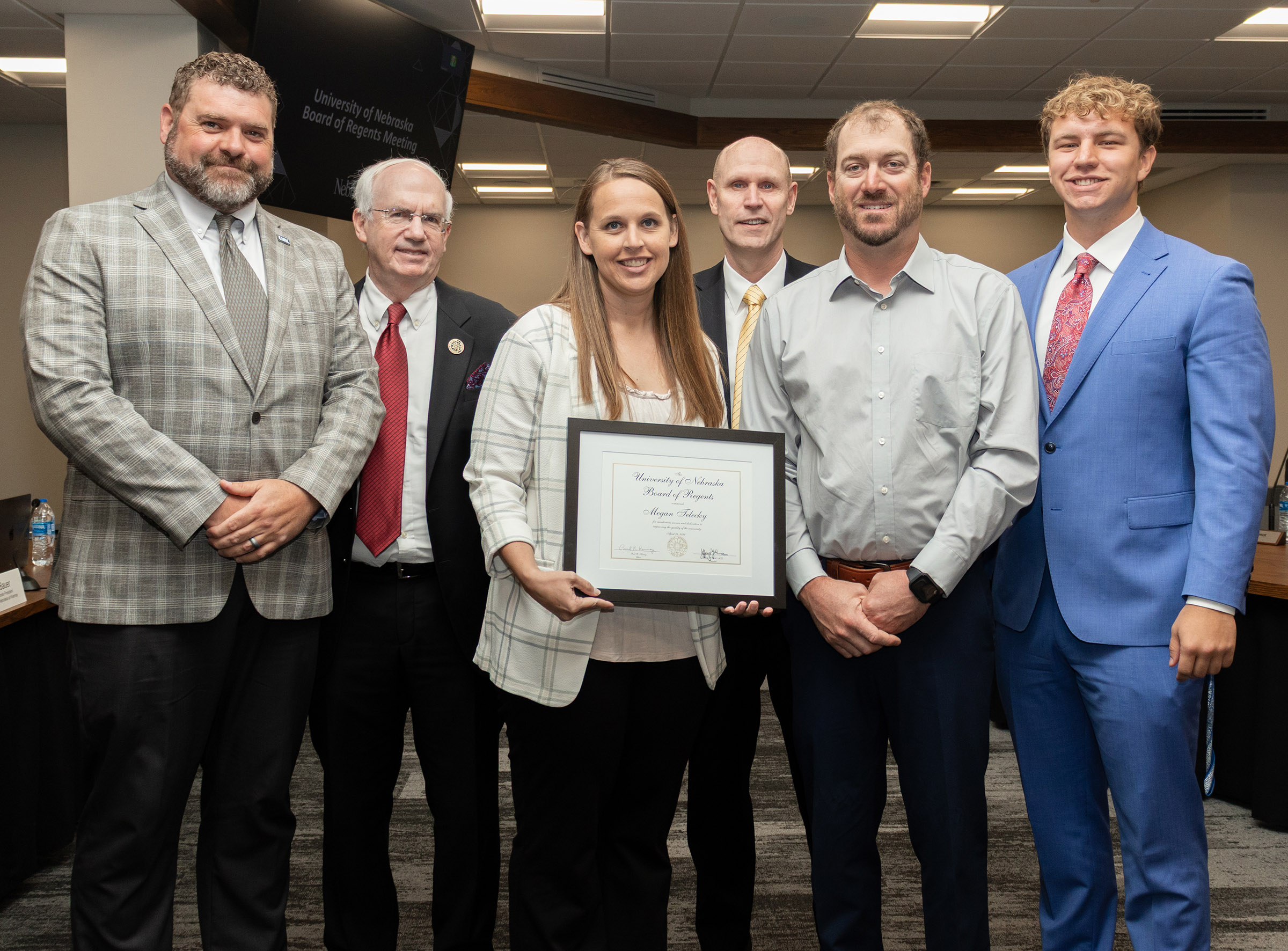 Megan Telecky receives the NU Board of Regents KUDOS award during Friday's meeting.
