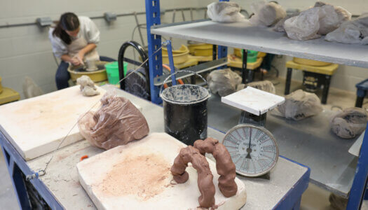 Students create pottery in ceramics class (Photo by Erika Pritchard, UNK Communications).