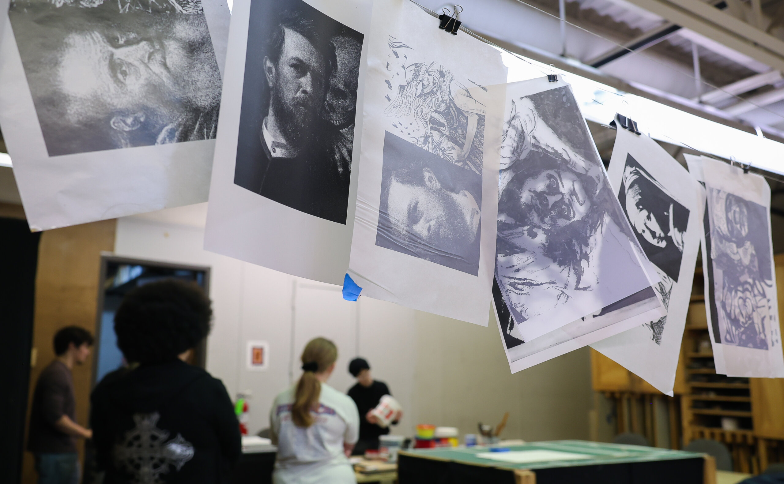 Prints hanging from a string.