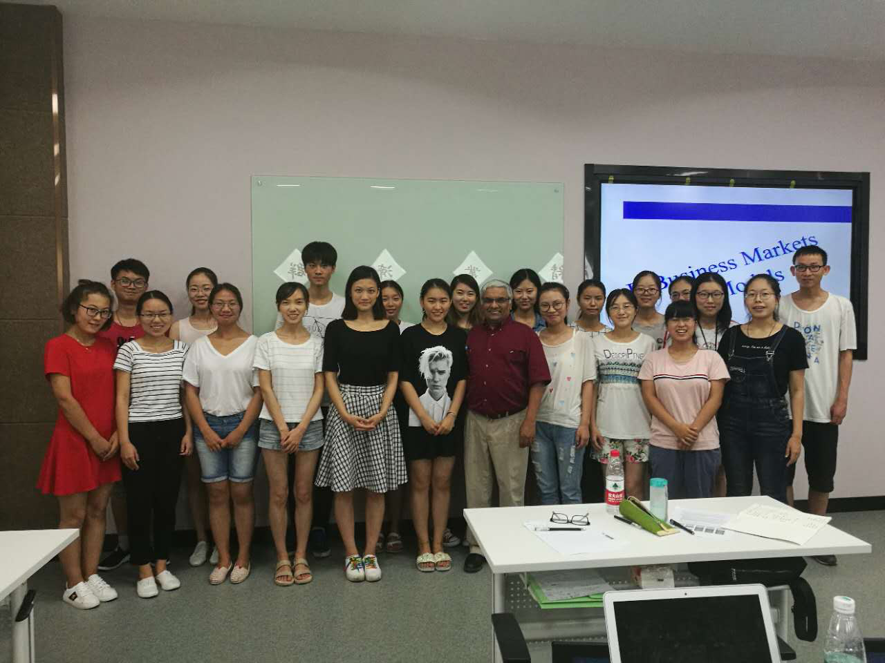 Sri Seshadri poses with students during his time as a visiting professor in China.