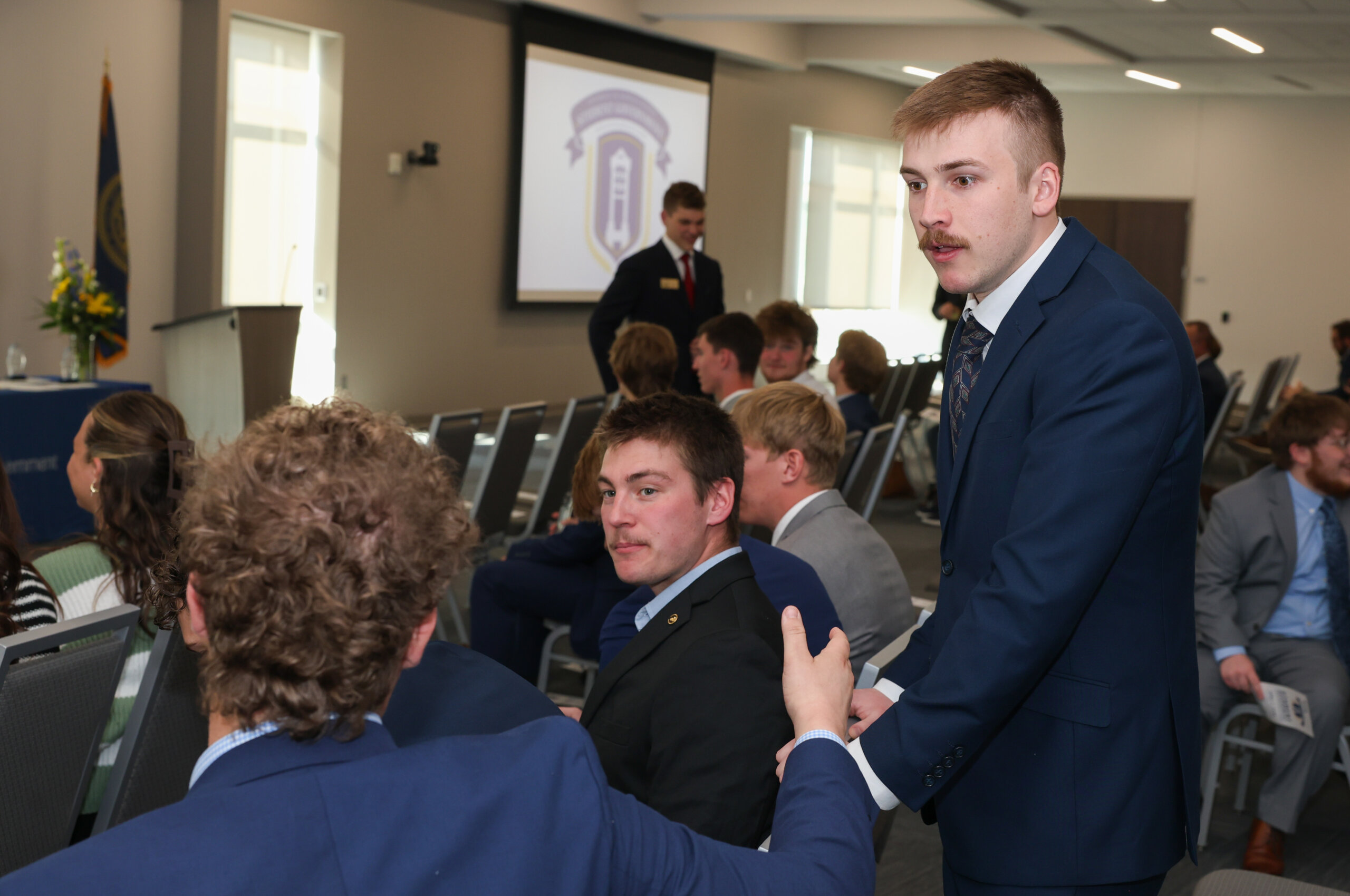 Male students converse.