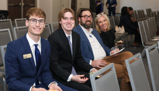 Student Government members and their family pose for a photo.