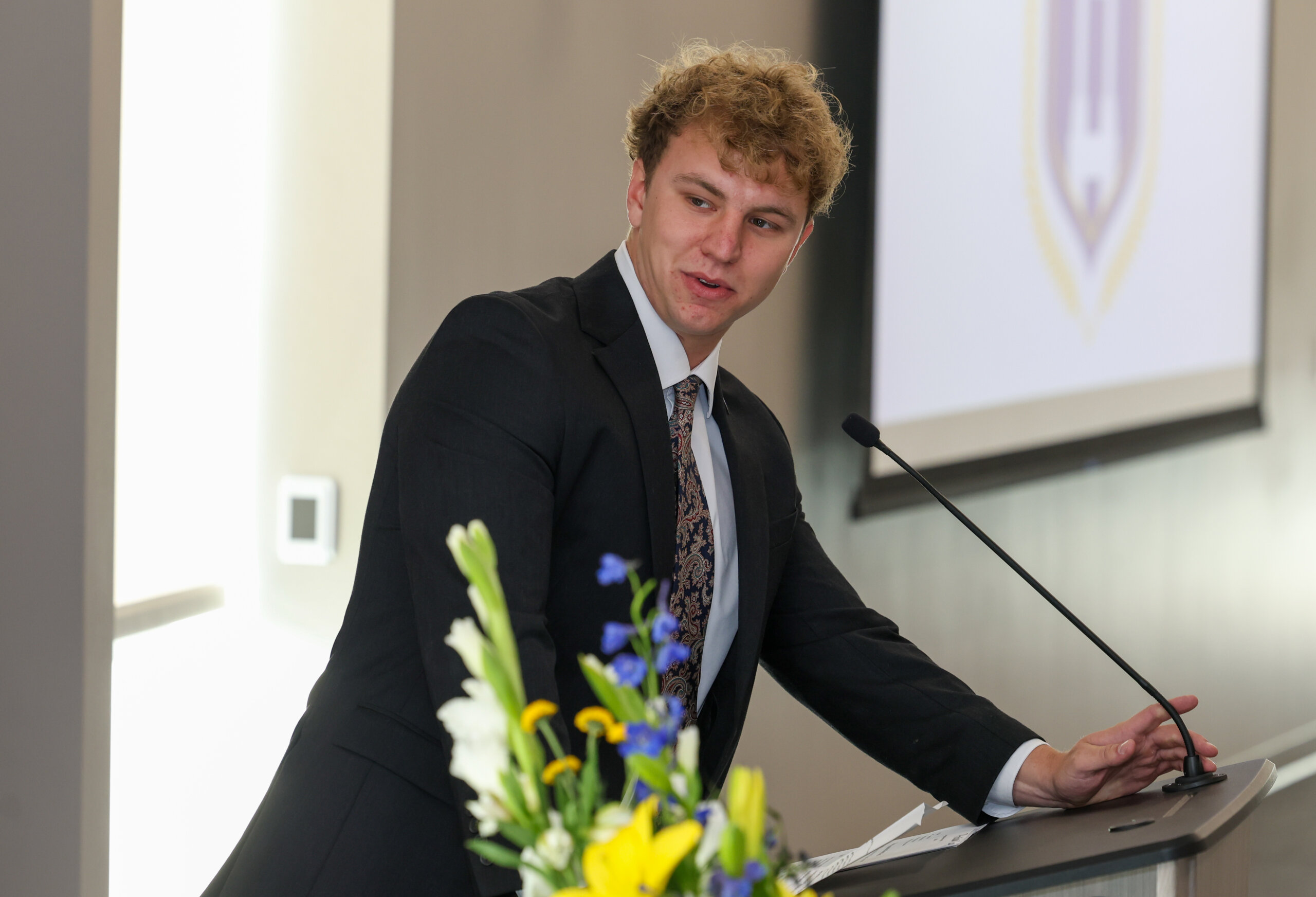A man speaks at the podium.