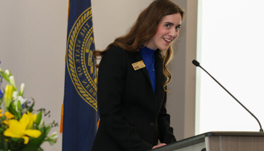 Emma Nolan speaks at the podium.