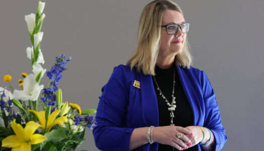 Student Engagement Director Renae Zimmer watches the ceremony.