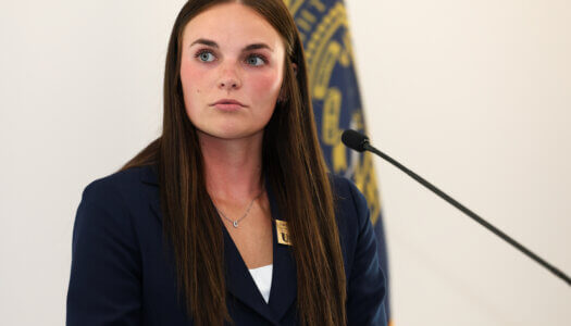 A member of Student Government speaks at the podium.