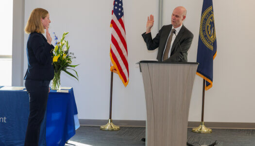 Chancellor Neal Schnoor swears in Paige Oltmans.