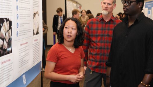 A UNK student presents their research during Student Research and Creative Activity Day.
