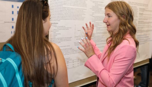 A UNK student presents their research during Student Research and Creative Activity Day.