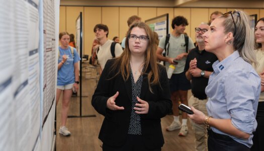 A UNK student presents their research during Student Research and Creative Activity Day.