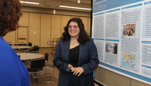 A UNK student presents their research during Student Research and Creative Activity Day.