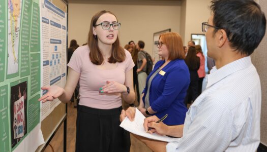 A UNK student presents their research during Student Research and Creative Activity Day.