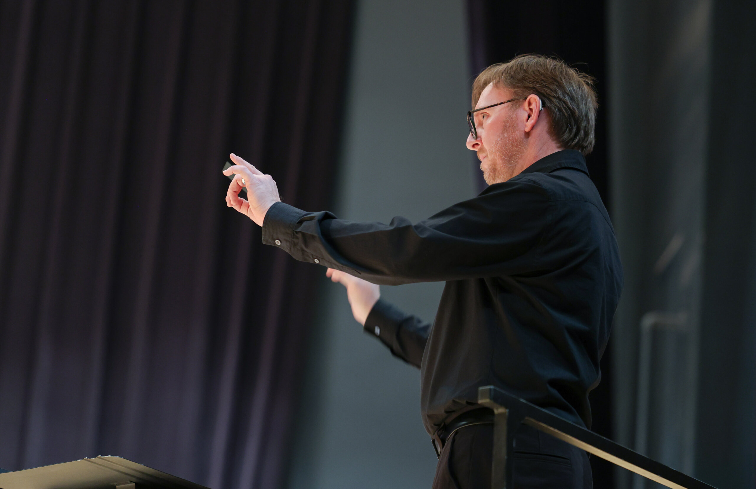 A man conducts a band.