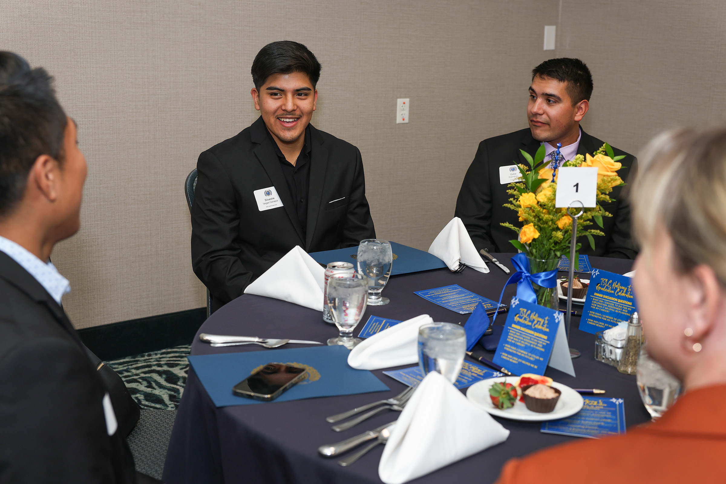 UNK sophomore Silvestre Vargas chats with other members of the Thompson Scholars program during a halfway to graduation celebration.