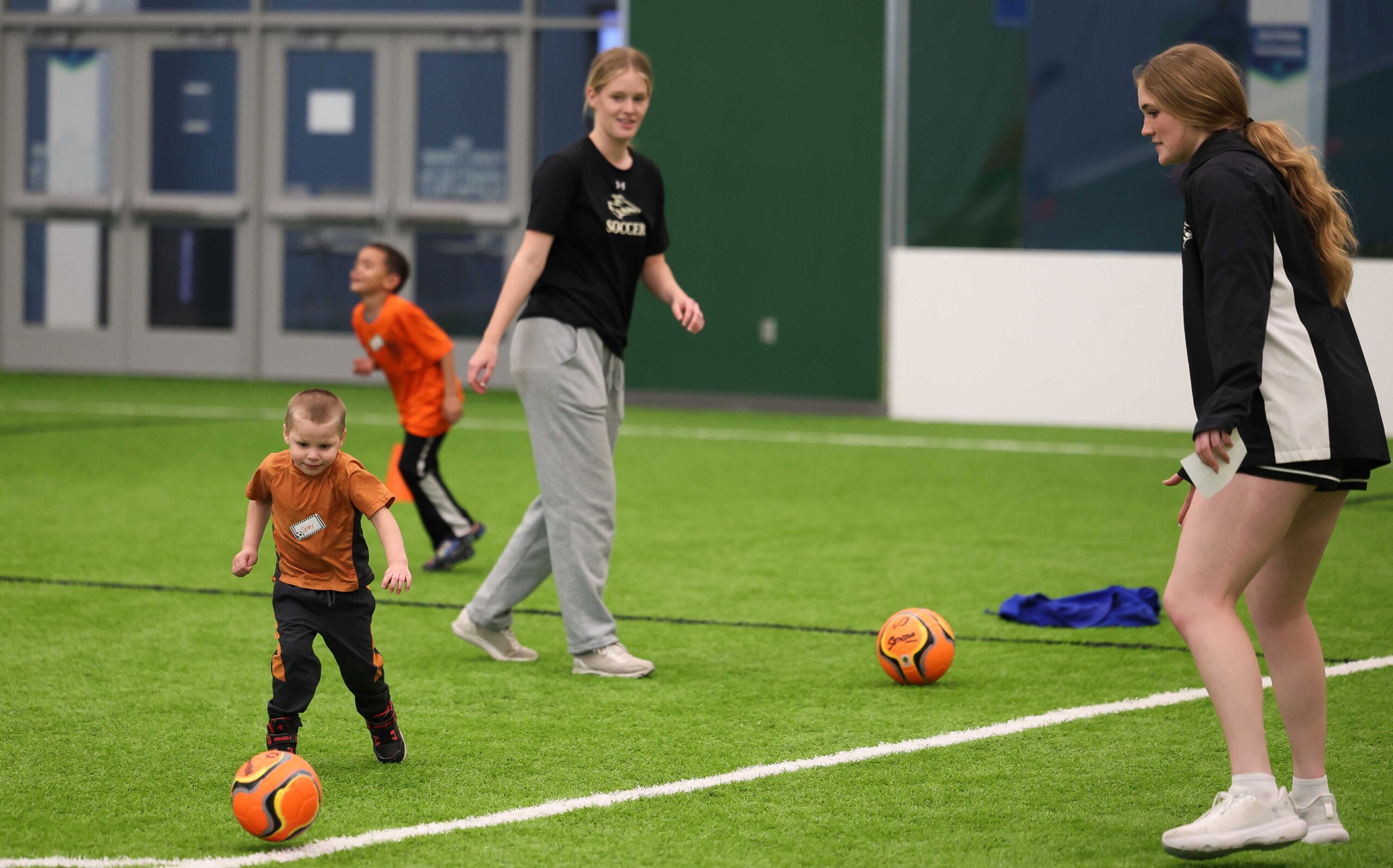 UNK women's soccer players assist during the TOPSoccer program in Kearney.